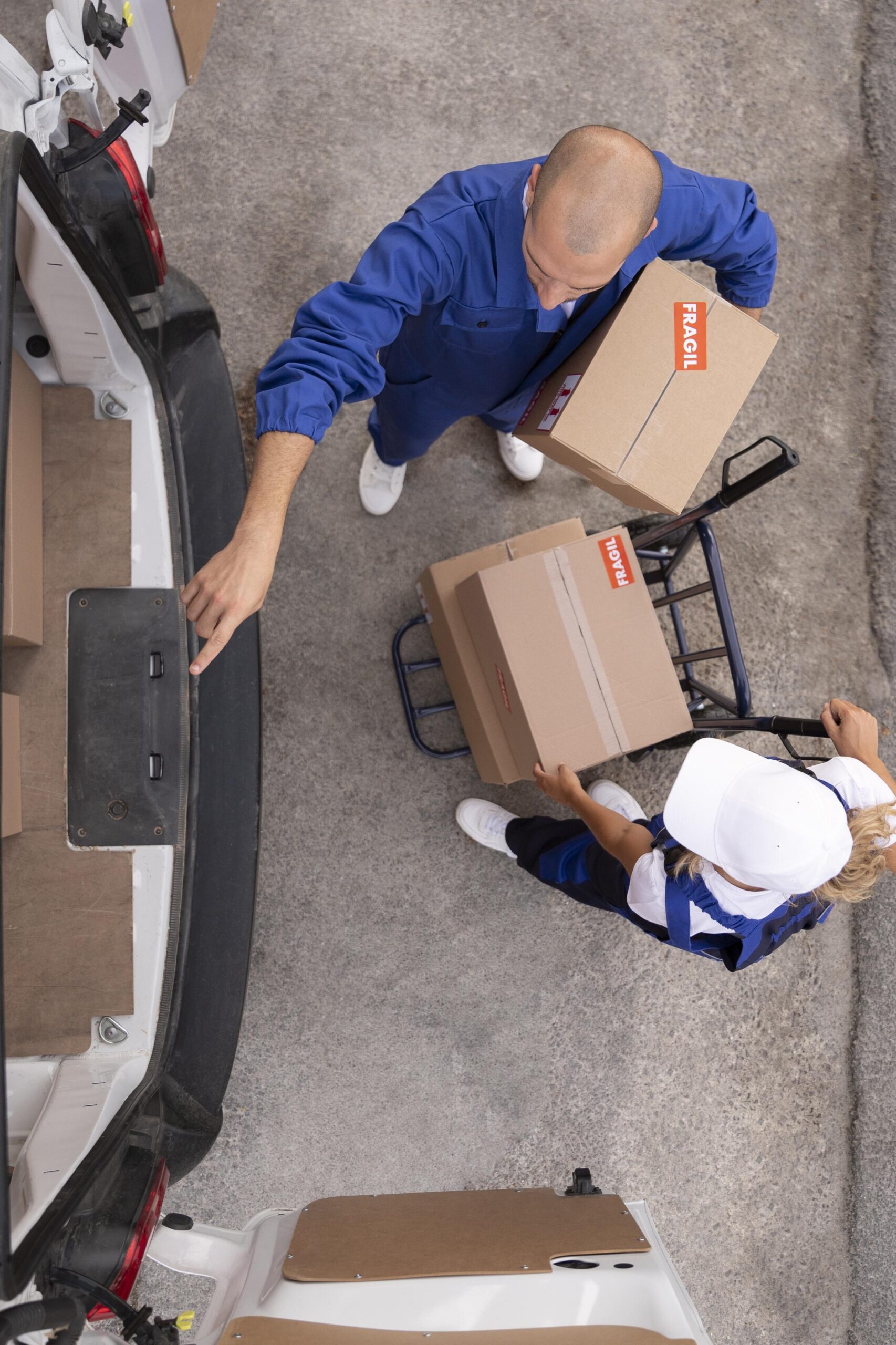 full-shot-delivery-people-holding-box